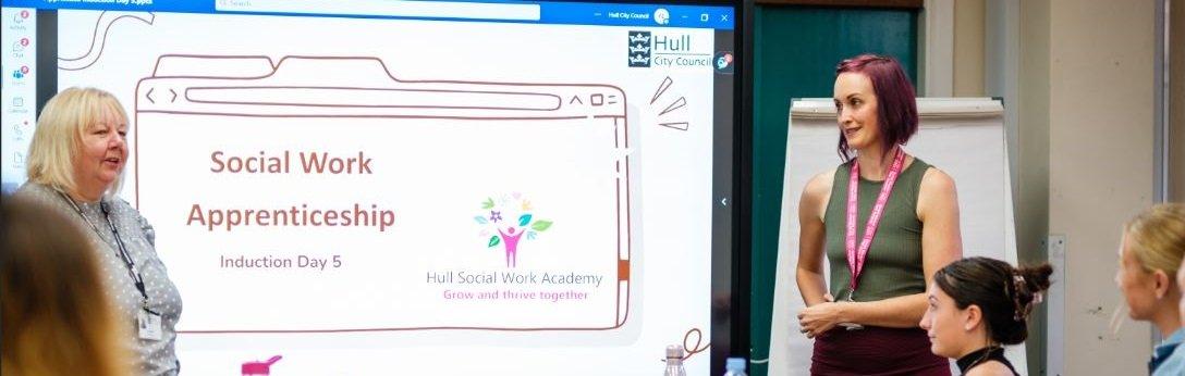 Two women giving a presentation on Hull Social Work Academy