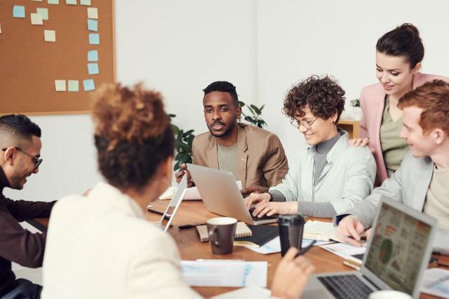 group of young workers learning