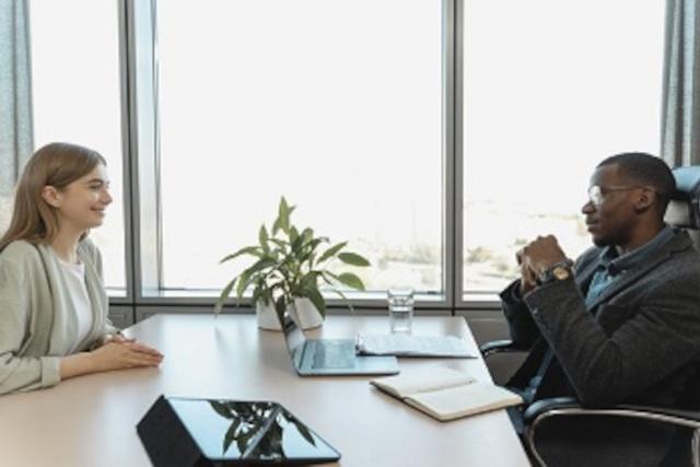 Woman having an interview with man