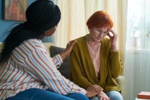 A care worker talking too a woman