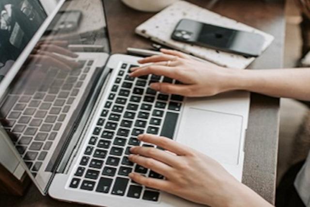 A laptop being typed on