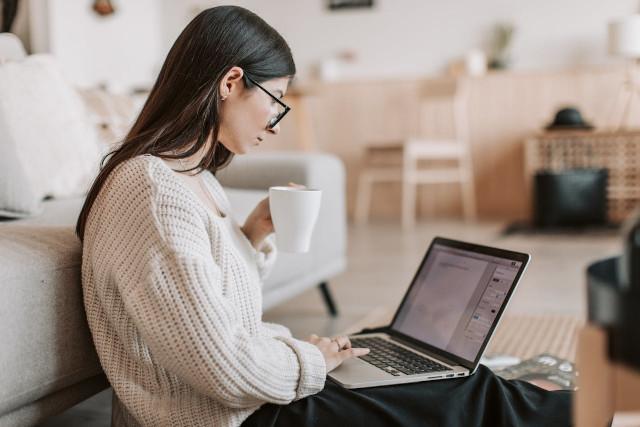 person reading information on a laptop