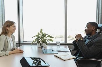 Woman having an interview with  man